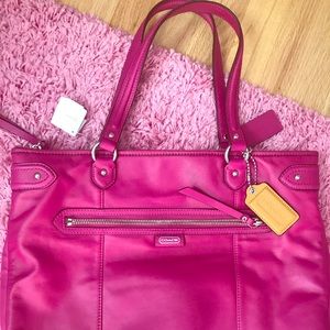 New with tags pink leather coach purse.